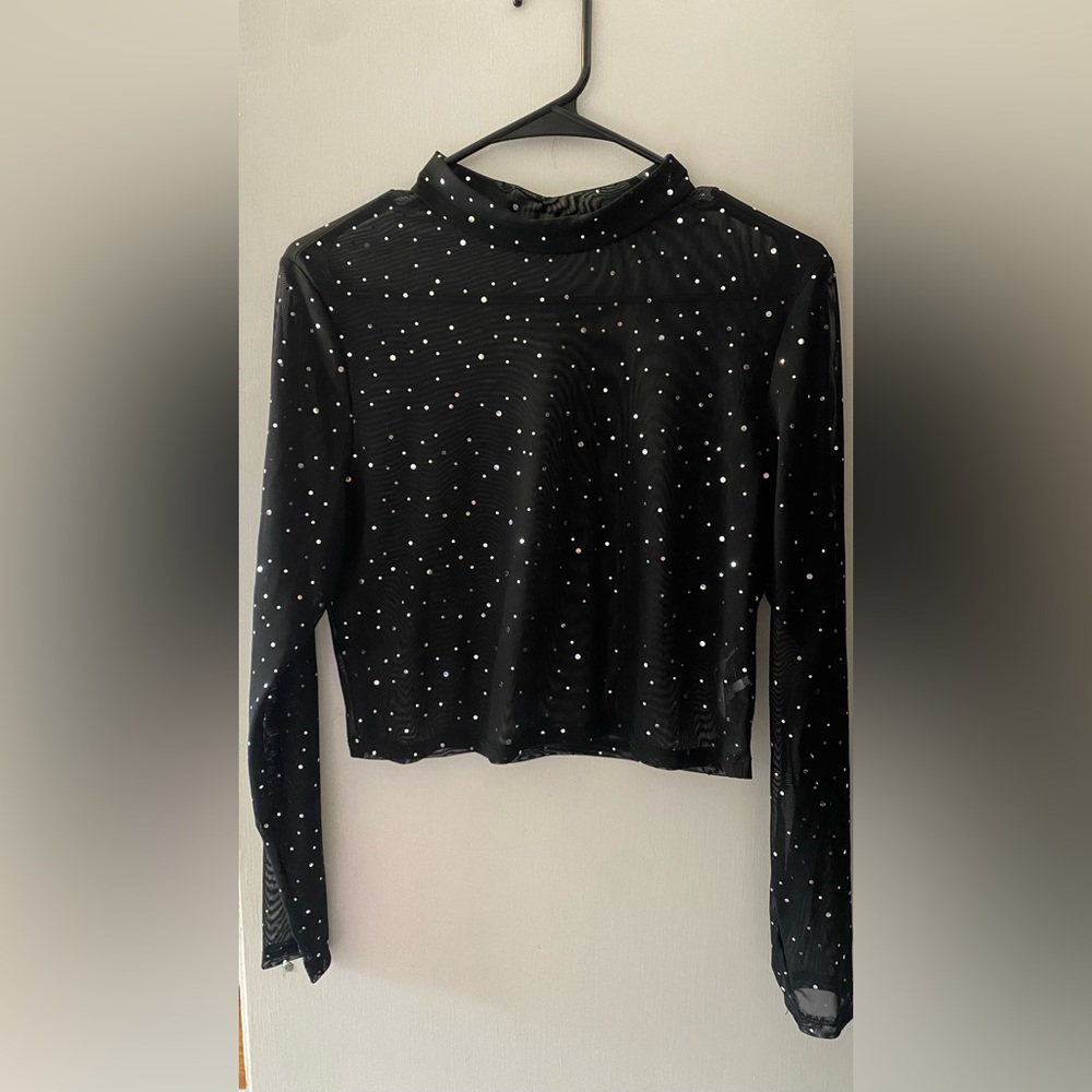 Black mesh top with sequins.